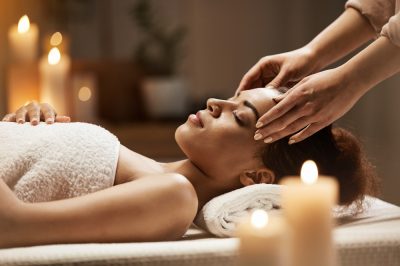 attractive-african-woman-enjoying-face-massage-spa-salon